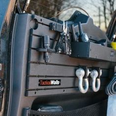 the back end of a truck with tools attached to it