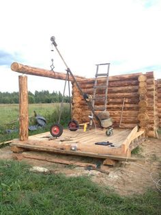 a wooden structure with tools on top of it