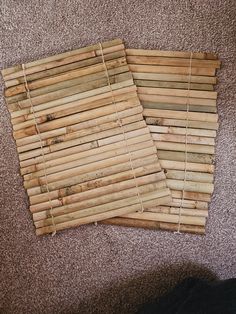 two pieces of bamboo laid out on the floor