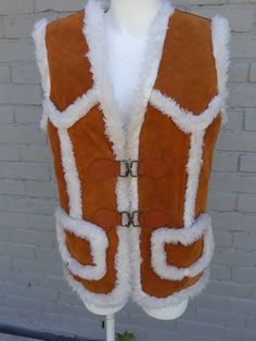 "Suede and shearling sherpa vest by PYPSA. This fabulous brown vest features super cozy sheepskin lining. It also has 2 buckle clip closures and two front waist pockets. Made in Mexico Tag reads 38, this is best suited to a small, possibly medium. Measurements taken with vest laying flat: Length 26\" Bust 38\" Waist 38\" Vest is in great vintage condition. The only issue is that it needs to be professionally cleaned. There is a pen mark on the front of vest. Other than that, no major staining bu Flora Nikrooz, Sherpa Vest, Brown Vest, Corpus Christi Tx, Lace Nightgown, Fabulous Fabrics, Cream Lace, Vintage Tops, Womens Vest