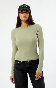 The Queen Long Sleeve Cropped T-Shirt from PS Basics by PacSun is a super cute staple that you'll love pairing with your favorite skirts, jeans, and sweats! This tee features a crew neckline, long sleeves, a slightly cropped length, and a fitted silhouette.


	Solid color tee
	Ribbed fabric
	Center back seam
	Long sleeves
	Crew neckline
	Cropped length
	Fitted silhouette
	95% rayon, 5% spandex
	Model is wearing a small Casual Seamless Crew Neck Cropped T-shirt, Ribbed Fitted Cropped T-shirt With Crew Neck, Seamless Crew Neck Cropped T-shirt, Solid Color Seamless Cropped T-shirt, Pacsun Long Sleeve Tops, Indie Brands, Short Rompers, Crop Tshirt, Casual Tee