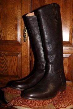 Ariat Western Riding boots in an deep dark espresso brown leather. NIB these are vintage recycled and never been worn. Women's size 11 M  Heel to toe outside measurement: 11 3/4" Ball of foot 3 1/4" Shaft height: 17 1/2" instep outside 18" Back zipper for easy on and off Beautiful boots inside and out!   Thank you for your consideration and my your day be filled with many recycled ideas and blessings Remember to: Reduce Reuse Recycle Repurpose Save the planet Brown Riding Boots With Leather Footbed, Brown Round Toe Riding Boots, Leather Riding Boots With Buckle Closure, Vintage Leather Riding Boots, Western Riding Boots, Brown Knee-high Riding Boots With Round Toe, Reuse Recycle Repurpose, Espresso Brown, Womens Riding Boots