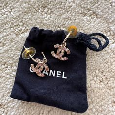 Euc, Like New, Chanel Rhinestone Gold Dangle Earrings. Rhinestones Are Of Pinkish Colors. No Flaws At All, Worn Only 2-3x. The Plastic Backing Is Yellowing, But Not Obvious When Worn. Chanel Stamp Is On The Side Of The Earrings, As Shown. Comes With Original Box And Jewelry Bag. Price Firm. Jewelry Chanel, Gold Dangle Earrings, Chanel Jewelry, Jewelry Bag, Gold Earrings Dangle, Rhinestone Earrings, Jewelry Bags, Original Box, Dangle Earrings