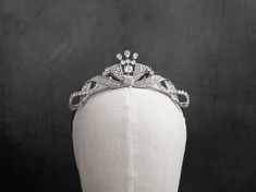 Exude the charm of yesteryear's glamour with our vintage-inspired tiara. Intricately designed with sparkling natural zircon stones, this headpiece is a nod to the timeless beauty of classic bridal fashion. Each zircon is meticulously set in a 24K white gold plated frame, providing a luxurious finish that captures the essence of traditional elegance. Key Features: Features natural zircon stones, celebrated for their diamond-like sparkle and clarity. The tiara is crafted with a 24K white gold plat Bridal Headpiece, Bridal Fashion, Bridal Headpieces, Wedding Hair Accessories, Bridal Style, Timeless Beauty, Vintage Design, Wedding Accessories, Headpiece