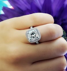 This 3.40 Ct. cushion cut diamond engagement ring has a classic design that will stand the test of time. A gorgeous 2.50 Ct. Cushion cut GIA Certified diamond is the center attraction accentuated with Round cut diamonds around it and down the shank. split Metal : Available in 14K Gold, 18K Gold or Platinum Setting Type : U-Setting, Pave, Prong Total Carat Weight : 3.40 Carats Type : Natural Genuine Diamond Shape : Cushion Cut Carat Weight : 2.50 Ct. (GIA Certified) GIA Certification : Included, Jupiter Jewelry, Cushion Cut Halo, Cushion Cut Diamond Engagement Ring, Cushion Diamond Ring, Cushion Halo Engagement Ring, Diamond Bridal Ring Sets, Ring Styles, Cushion Cut Diamond, Cushion Cut Engagement Ring