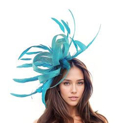 Hats By Cressida Kentucky Derby & Ascot Fascinator Hats Dark Turquoise Melik Feathers & Sinamay Fascinator Beautiful dark turquoise sinamay loops and turquoise coque feathers fascinator Body Measures about 7-8 Inches wide, with feathers about 22 inches wide Mounted with a matching headband. If you prefer a headband to match your hair, please make a note at check out what colour headband you want. Are you looking for the perfect headpiece for your upcoming formal event or special occasion? Our Melik Sinamay & Feathers Fascinator Hat is a great choice if you want a fascinator hatfor such occasions as the Kentucky Derby, Royal Ascot, Ladies Day, races or a wedding. Whether you wear it to a church service, cocktail party, or formal occasion, this hat is sure to make a statement. We make each h Elegant Turquoise Fascinator For Races, Turquoise Headpiece For Kentucky Derby Races, Turquoise Headpieces For Kentucky Derby, Turquoise Fascinator For Spring Party, Turquoise Headpiece For Summer Wedding, Turquoise Headpieces For Summer Weddings, Spring Turquoise Headpiece For Parties, Fitted Turquoise Hat For Party, Turquoise Fitted Party Hat