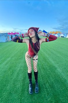 🔥🎉 Unleash your festival flair with this eye-catching rave outfit! Featuring bold patterns, vibrant accessories, and statement boots, this look is perfect for standing out on the festival grounds. Dance, pose, and create unforgettable moments with your unique style. 🎶✨ #RaveOutfit #FestivalFashion #RaveGirl #MusicFestivalOutfit #FreedomRaveWear #FestivalFlair #UniqueStyle Edgy Rave Outfit, Vibrant Accessories, Festival Grounds, Statement Boots, Dance Pose