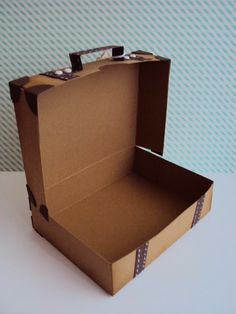 an open cardboard box sitting on top of a table