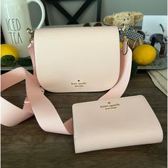 Nwot Pink Kate Spade Madison Saffiano Leather Saddle Bag And Lelia Medium Compact Bifold Wallet. Wallet And Purse Are The Same Pale Pink Color - Perfect Matching Set. Bought And Removed Tags But Realized It’s Too Small For What I Need. My Loss Is Your Gain! Bag 6” H X 3.2” D X 8.2” W Strap Drop 24” At Longest Flap With Magnetic Snap Closure Back And Front Slip Pockets Wallet 4.5” H X 5.5” W X 1” D Pebbled Leather 8 Credit Card Slots, Id Window, 4 Slip Pockets, 2 Billfolds And 1 Zip Coin Compartm Kate Spade Everyday Bifold Bag, Kate Spade Bags With Card Slots For Gift, Classic Kate Spade Bags With Card Slots, Kate Spade Evening Bags With Card Slots, Pink Leather Bifold Bags, Kate Spade Formal Bags With Card Slots, Chic Leather Bifold Bags, Chic Bifold Leather Bag, Blush Bag With Card Slots