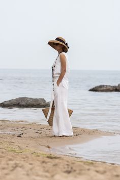 "This Pure Linen wrap pants is simple and stylish. You can adjust the comfortable fit using the ties and inside button Two side pockets 100% linen Match with: https://www.etsy.com/uk/listing/1481459252/minimalist-white-linen-top-linen-tank The white linen fabric is not optical white White linen fabrics are always transparent HEIGHT OF MODEL: 168 cm. / 5′ 6″  Size S All garments are handmade. We accept Returns and Exchange Please provide your PHONE NUMBER for delivery   EXPRESS delivery for ALL ORDERS   Accessories are not for sale. If you have different measurements please inform us. SIZE CHART (measurements of the body NOT of the garment ) XS Bust 82 - 84 cm | 32.28 - 33.07\" Waist 63 - 67 cm | 24.80 - 26.38\" Hips 86 - 90 cm | 33.86 - 35.43\" Inseam 74 cm | 29.13\" Inseam Long 84 cm | 33 Linen Harem Pants For Beach In Summer, Linen Harem Pants For Summer Beach, Linen Harem Pants For Beach And Summer, Linen Ankle-length Harem Pants For Beach, Ankle-length Linen Harem Pants For Beach, Bohemian Linen Bottoms For Vacation, Chic Linen Beach Pants, Chic Linen Pants For Beach, Bohemian Linen Vacation Bottoms