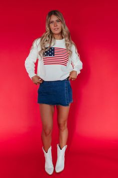 Stay stylish and show your patriotic spirit with our American Flag Sweater in ivory. This trendy and cute sweater features embroidered stars and stripes in classic red, white, and blue. Paired with THE KALEI DENIM SKORT IN DARK WASH and THE BOW SANDALS IN IVORY. Embroidered stars American flag design Round neck Ribbed collar and hem 60% cotton, 40% acrylic Fits true to size. X-Small/Small(0-2), Small/Medium (4-6), Large/X-Large (8-12) Model is 5'5" wearing a size XS/S. To view our return policy, Happy Threads, Summer Goddess, Flag Sweater, American Flag Sweater, Embroidered Stars, Pink Desert, American Flag Design, Denim Skort, Eagle Tee