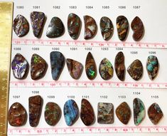 several different types of stones are displayed on a ruler