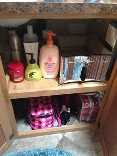 the bathroom cabinet is filled with toiletries and personal care items