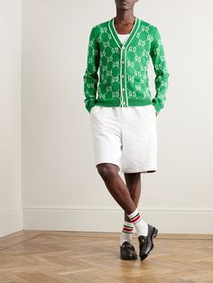 Gucci's cardigan is intarsia-knitted with the iconic '70s 'GG' logo, an evolution of the original '30s 'Rhombi' design. It's made from soft cotton with a classic striped V-neck. Style yours with tailored shorts and sneakers. Gucci Cardigan, Cardigan For Men, Gucci Collection, Gucci Outfits, Gg Logo, Tailored Shorts, Cotton Cardigan, Knitwear Cardigan, 70s Fashion