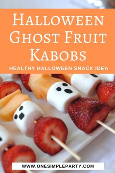 halloween ghost fruit kabobs on a white plate