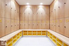 the lockers are lined up with numbered numbers and yellow bins on each side