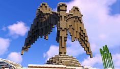 an angel statue made out of blocks in the sky