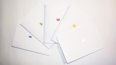 four blank cards with hearts and stars on them