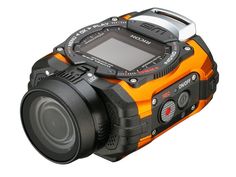 an orange and black digital camera on a white background