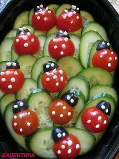 cucumber and tomato salad in a bowl with ladybugs on them, ready to be eaten