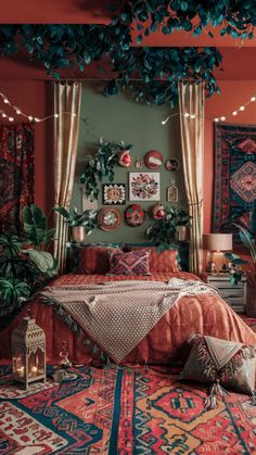 a bedroom decorated in red, orange and blue colors with lots of plants on the wall