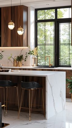 a modern kitchen with marble counter tops and gold bar stools next to the island