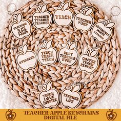 the teacher apple key chains are made out of wood and have words written on them