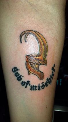 a tattoo on the leg of a person with a crescent and words written in it