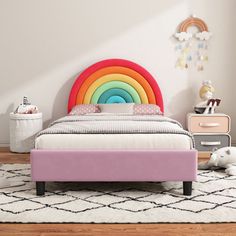 a child's bedroom with a rainbow bed