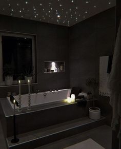 a white bath tub sitting next to a window