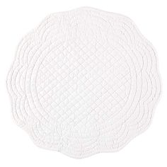 four white placemats on top of each other in the shape of a circle