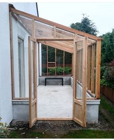 an open door to a small garden room