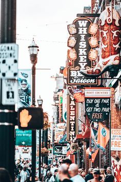 a city street filled with lots of neon signs