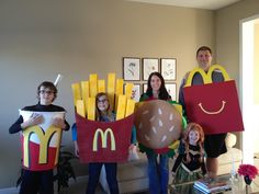 four people are dressed up as mcdonald's and fries