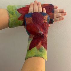 This Felted Wool Hand Warmers Are Super Soft And Structured. Fleets To Look Like A Flower, They Have Beads And Tinsel Sewn To The Center To Act As The Pistil. They Have A Raw Edge, Accept For The Thumb Whole. Awesome Accessory!