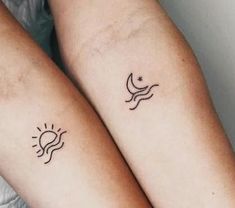 two people with matching tattoos on their arms, one has a sun and the other has a bird