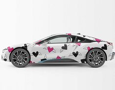 a white sports car with hearts on it