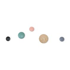 an assortment of different shapes and sizes of wood buttons on a white background with space for text