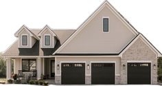 a house with two garages and three windows