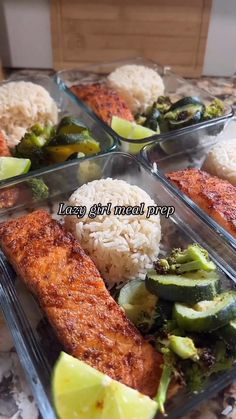 four plastic trays filled with food on top of a marble countertop next to rice, broccoli and cucumbers