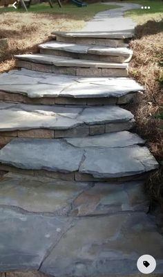 stone steps lead up to the back yard