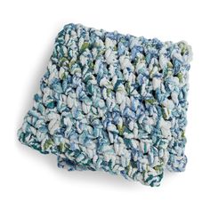 a blue and white dishcloth on a white background