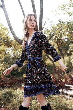 Meet our Alannah Playdress, the mini version of our striking gown, the Alannah Maxi Dress. This cute playdress perfectly showcases our whimsical Ditsy Charm print and is the ultimate versatile piece that you will reach for day after day. The Alannah Playdress is the ultimate combination of comfort and effortless bohemian styling with a flirty twist. Take it to work with an ankle boot or heels, or dress down your look with sneakers or flats for comfortable weekend style. Perfect for long lazy lun Bohemian A-line Midi Dress For Garden Party, Black Boho Print V-neck Dress, Black A-line Bohemian Dress, Black Bohemian A-line Dress, V-neck Boho Print Dress For Garden Party, Black Boho Print Spring Dress, Bohemian Ditsy Floral Dress For Garden Party, Bohemian Ditsy Floral Print Garden Party Dress, Bohemian Ditsy Floral Print Dress For Garden Party