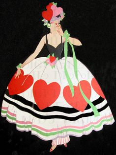 a paper cutout of a woman in a dress with hearts on it's skirt