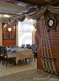 a dining room with tables and chairs in it