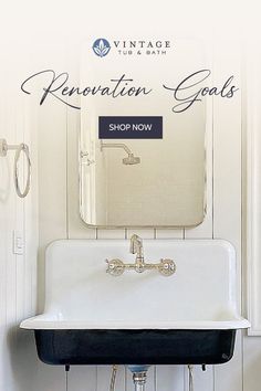 a white sink sitting under a bathroom mirror next to a wall mounted faucet