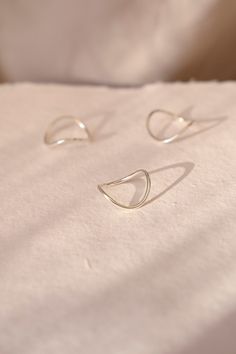 Inspired by our smallest rivers, largest oceans and the ebb and flow of life itself, the Sterling Silver Flow Ring | Eco friendly Jewellery | Curved Ring | Curvy Silver Ring | Stacking Ring | Everyday Ethical Jewellery | Minimal takes minimalism and adds a handmade unique feel to it. This is our go-to collection for those who love simple jewellery with a hint of movement. Founded and led by women, our jewellery is handmade in London UK, using recycled and traceable silver and solid gold with ethical processes, perfect for those who prefer a sustainable and environmentally conscious eco-friendly lifestyle. -Sizing- You can choose any size, the below is for guidance. Small is UK ring size L (USA size 5.75). Diameter 16.3mm. Circumference 51.2mm Medium is UK ring size N (USA size 6.75) Diamet Jewellery Minimal, Curved Ring, Simple Jewellery, Forward Helix Piercing, Curve Ring, Ring Everyday, Love Simple, Ebb And Flow, Life Itself