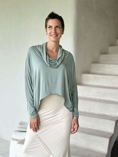 Dolman Cowl Top The Dolman Cowl Top is our best-selling top. It is soft, loose, lightweight, and has an effortless oversized feel with extra-long dolman sleeves and thumb holes. We love layering this relaxed-fit top over our slim-fit tanks, tees, and dresses. One Size (O/S) Colors This long sleeve jersey top is available in these colors: Copper Steel Plum Black Canal Blue Jam Jasper Navy Scarlet Teal White Wine Moss Cream Learn MoreWant to learn more about our plant-based fabrics made in small b Slouchy Top For Spring, Effortless Oversized Top For Layering, Everyday Tops With Batwing Sleeves, Slouchy Batwing Sleeve Tops For Layering, Versatile Oversized Top For Spring, Oversized Versatile Tops For Spring, Oversized Versatile Top, Versatile Spring Tops With Batwing Sleeves, Spring Versatile Batwing Sleeve Top