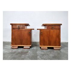 pair of mid - century modern nightstands in teak wood with brass hardware, circa 1950's