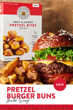 a box of pretzel burger buns next to a hamburger with fries on the side